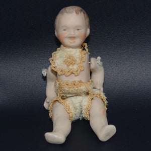 Bisque jointed and dressed baby boy doll | stringing needs tightening