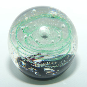 Controlled bubble within Green Swirl paperweight