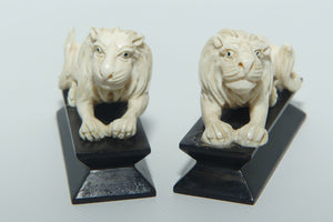 Pair of Chinese Carved Ivory small Lion Figures on Ebony bases | c.1950