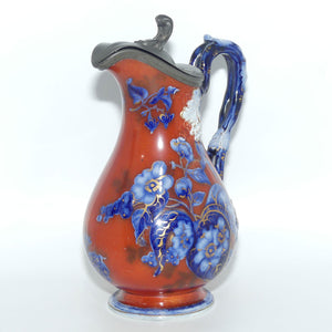 Victorian era Iron Red and Flow Blue decorated Pewter lidded jug