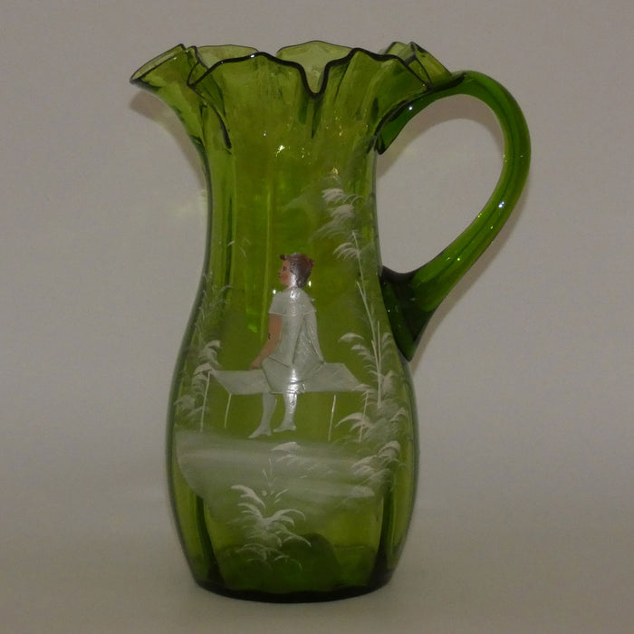 Green Mary Gregory crimped rim glass jug depicting a young girl sitting on bench