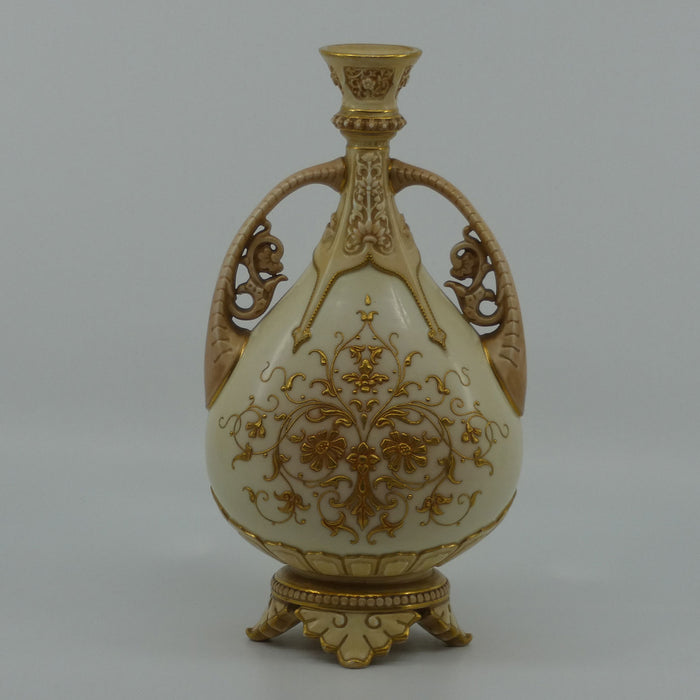 Royal Worcester Blush Ivory heavily gilt handled vase on quad feet