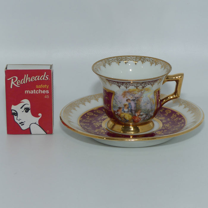 Monarch porcelain dArt Limoges France Traditional Courting miniature tea cup and saucer duo