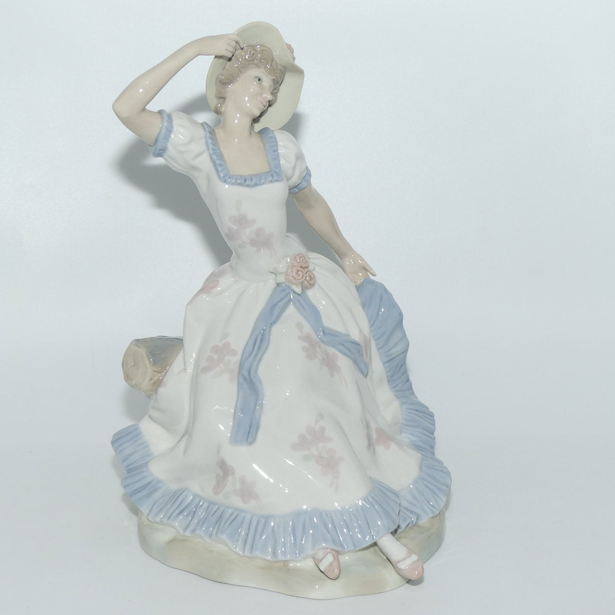 Zaphir Nao Lladro figure of a Seated Lady in Sun Hat Roundabout