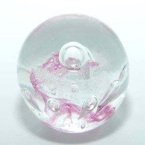 Controlled bubble within Pink Swirl paperweight