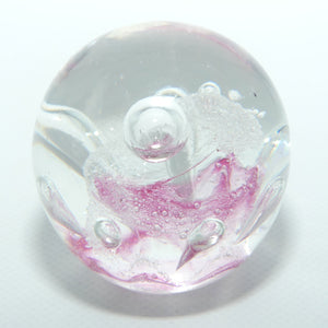 Controlled bubble within Pink Swirl paperweight