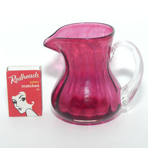 Small Cranberry Glass jug with reeded handle