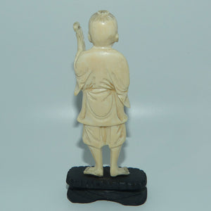 Japanese Carved Ivory figure of an Elder Fisherman with Catch