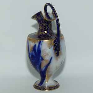 Doulton Burslem Blue Iris and Daffodil loop handle jug with gilt highlights