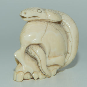 Japanese Carved Ivory Netsuke | Cobra intertwined through Skull