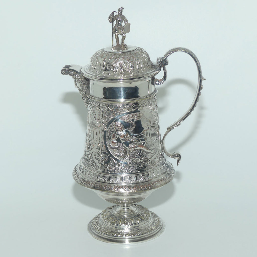 John Grinsell and Sons Silver Plate Heavily decorated Wine Jug with motto Patientia Solertia Nolvi
