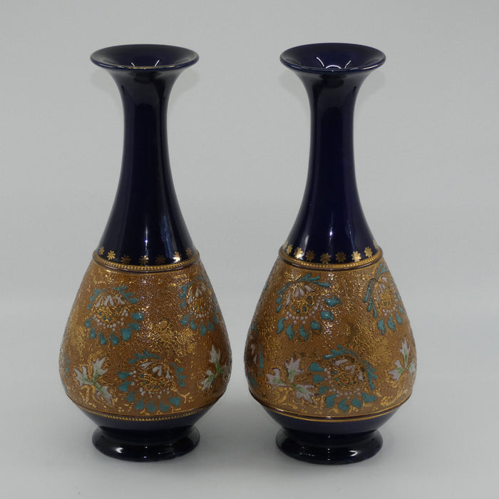 Doulton Slaters stoneware pair of narrowneck bulbous vases with blue, white & green enamelling and gilt highlights (stamped 672)