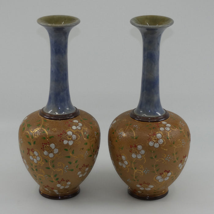 Royal Doulton pair of stoneware narrowneck bulbous vases with red, white & green enamelling and gilt highlights (stamped 8420)