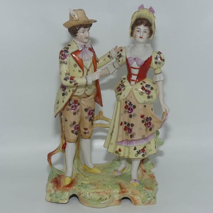 Victorian era Lady and Gent bisque figurine group