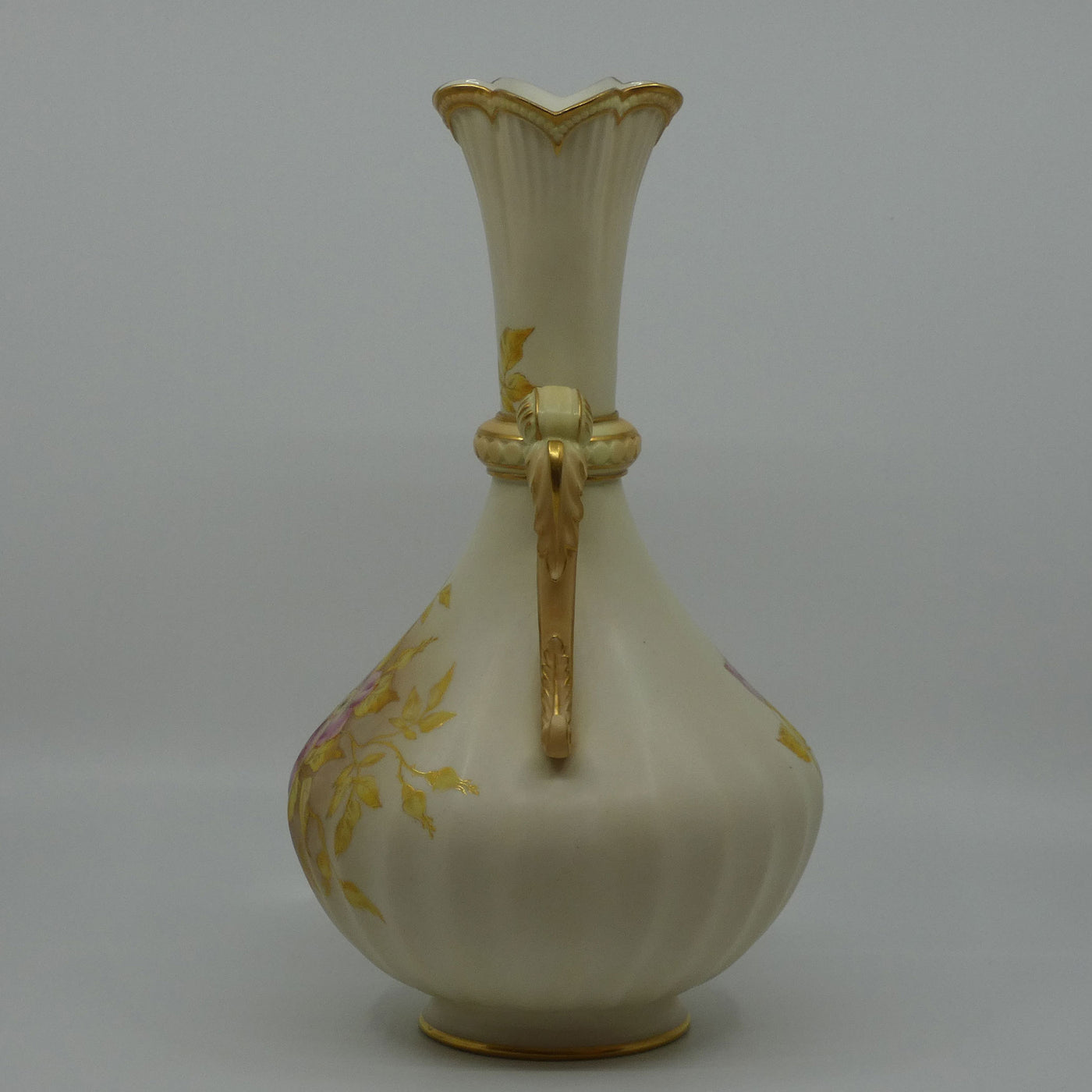 Royal Worcester Blush Ivory hand painted and gilt handled vase 