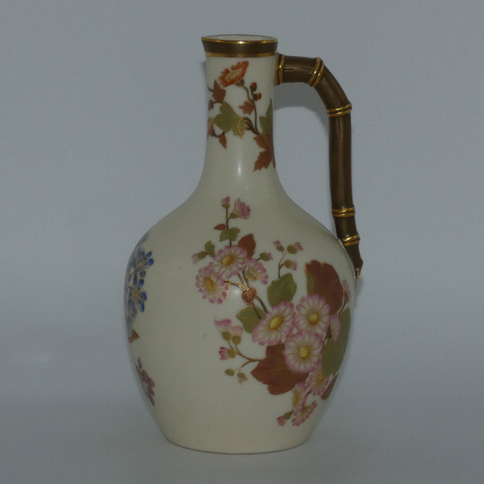 Royal Worcester Blush Ivory and gilt hand painted floral jug with bamboo style handle