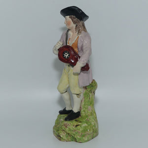 19th Cent English Pottery Man in Hat Carrying Instrument