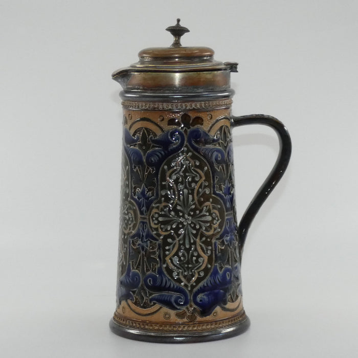 Doulton Lambeth stoneware lidded ale jug with pate-sur-pate cartouches and incised scrollwork  (Parker)