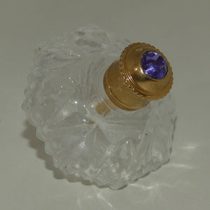 small-hexagonal-perfume-bottle-with-brass-stopper-and-purple-stone