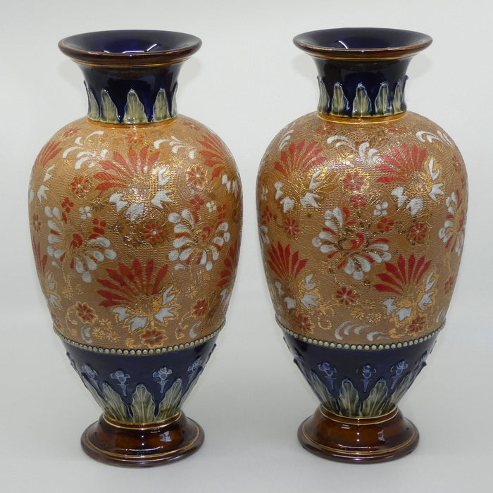 Royal Doulton stoneware pair of bulbous vases with red & white enamelled flowers, gilt highlights, applied leaves & dots (stamped 4461)