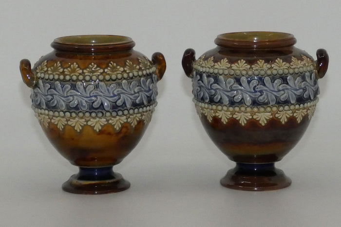 Doulton Lambeth stoneware pair of handled and footed urns (#4505)